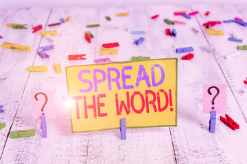 Text sign showing Spread The Word. Business photo text share the information or news using social media Scribbled and crumbling sheet with paper clips placed on the wooden table