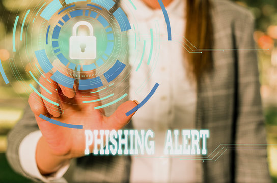 Writing note showing Phishing Alert. Business concept for aware to fraudulent attempt to obtain sensitive information Female human wear formal work suit presenting smart device