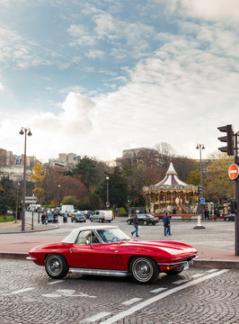 Paris, France 27 November 2013: A red 1963 Chevrolet Corvette driving in the center of Paris.