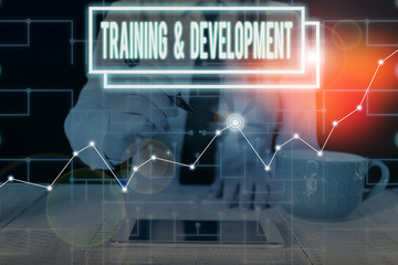 Writing note showing Training And Development. Business concept for learn specific knowledge to improve perforanalysisce Woman wear formal work suit present using smart latest device