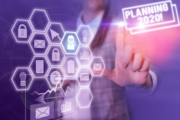 Conceptual hand writing showing Planning 2020. Concept meaning process of making plans for...