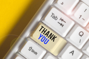 Writing note showing Thank You. Business concept for a polite expression used when acknowledging a...