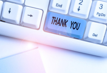 Writing note showing Thank You. Business concept for a polite expression used when acknowledging a...