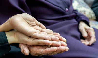 old lady hands with young hands
