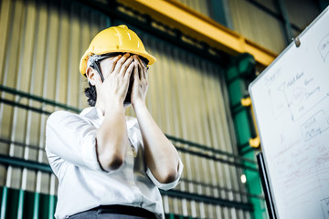 A young Asian office worker is sad and was severely criticized by her boss for her mistakes.