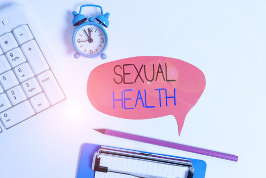 Word writing text Sexual Health. Business photo showcasing positive and respectful approach to sexual relationships Flat lay above table with clock pc keyboard and copy space note paper