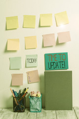 Conceptual hand writing showing Time To Update. Concept meaning this is right moment to make something more modern new Sticky Notes Card on Wall Pencil Pots Notebook on Work Desk