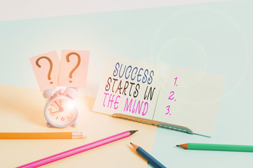 Writing note showing Success Starts In The Mind. Business concept for set your mind to positivity it can go a long way Mini size alarm clock beside stationary on pastel backdrop
