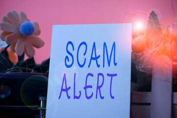 Handwriting text Scam Alert. Conceptual photo unsolicited email that claims the prospect of a...
