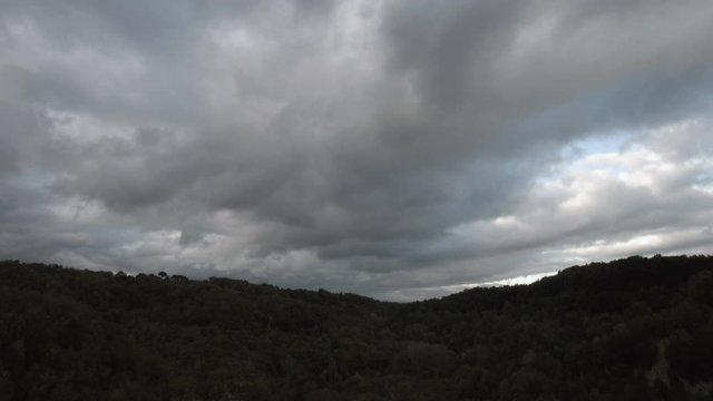 Time lapse of stormy sky in a country and hills landscape SF