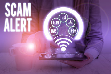Writing note showing Scam Alert. Business concept for unsolicited email that claims the prospect of...