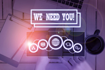 Conceptual hand writing showing We Need You. Concept meaning asking someone to work together for...