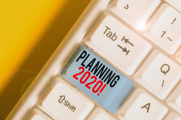 Obraz premium Word writing text Planning 2020. Business photo showcasing process of making plans for something next year White pc keyboard with empty note paper above white background key copy space