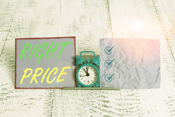 Text sign showing Right Price. Business photo text the amount of money that it is reasonable for the product Mini blue alarm clock standing above buffer wire between two notation paper