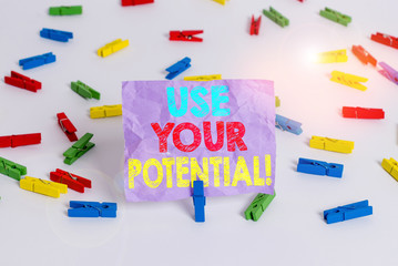 Writing note showing Use Your Potential. Business concept for achieve as much natural ability makes possible Colored clothespin papers empty reminder white floor background office