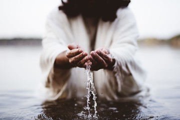 Fototapeta Biblical scene - of Jesus Christ drinking water with his hands obraz