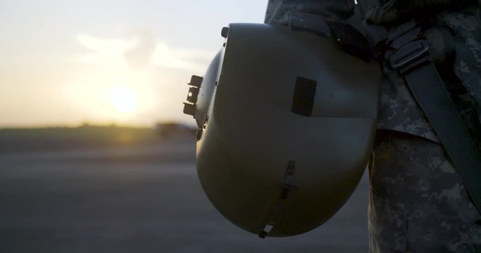 slow motion army helmet at sunrise