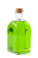 Magic spell and potion, apothecary elixir or deadly poison conceptual idea with vintage glass bottle containing green liquid isolated on white background with clipping path cutout