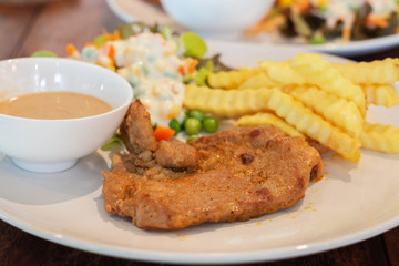 pork steak on white plate