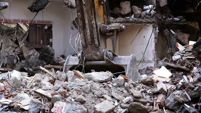 Destroying Old House With Bulldozer Mechanical Arm