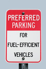 Sign for paring for fuel-efficient vehicles.  Isolated on light blue background.