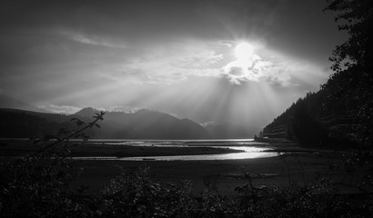 Sun rays over lake close to Mount Rainier