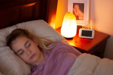 Sleeping with salt lamp  - wifi baby montior - obrazy, fototapety, plakaty