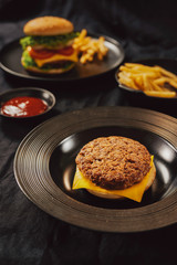 Fresh Tasty burger on dish with with french fries, ketchup