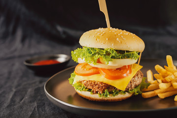 Unhealthy concept. unhealthy food: Burger, sauce, potatoes, cola.