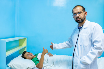Doctor and patient thumbs up for his full recovery