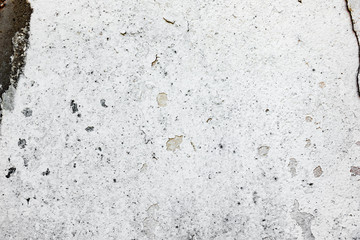 Texture of a concrete wall with cracks and scratches which can be used as a background