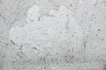 Texture of a concrete wall with cracks and scratches which can be used as a background