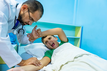 Doctor treating patient with needle
