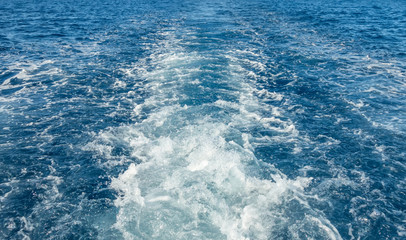 Fototapeta na wymiar Foam waves blue sea water texture