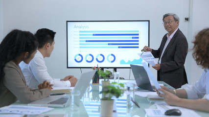 Business concepts. The management is explaining the marketing plan at the meeting. 4k Resolution.