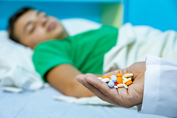 Doctor giving his patient some medicine