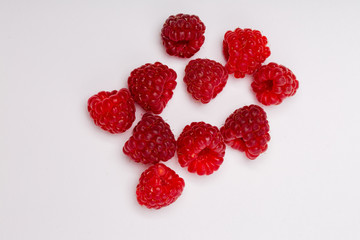 fresh raspberries on white background