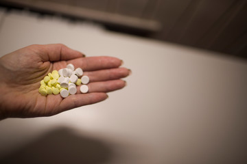 Colorful pills on hand