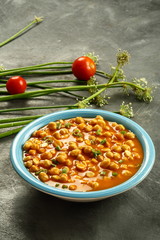 Bowl of chana masala, channa, chickpea curry Indian vegan meal.