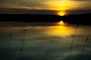 Beautiful sunset reflected in the lake. Scenic landscape