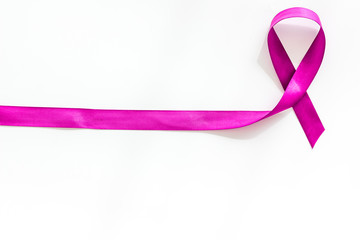Lavender ribbon is symbol of Alzheimers disease on white background top view space for text