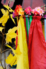 Still life of colorful ribbons and a wreath of flowers. Colors of autumn