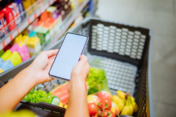 phone with empty blank white screen shopping cart on background