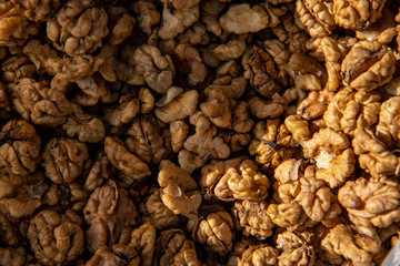 Walnut background. Walnuts peeled close-up shot in the market