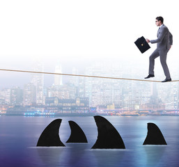 Obraz premium Hand cutting rope in business risk concept