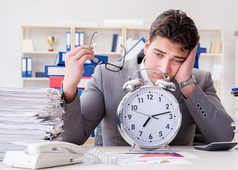Businessman missing deadlines due to excessive work