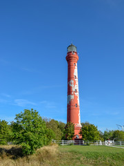 beautiful red lighthouse on the sea shore