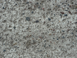 Concrete wall with included small multi-colored. For the background.