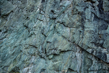 Unprocessed natural stone with grain as background
