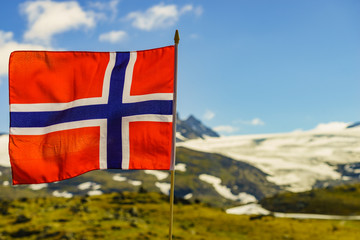 Norwegian flag and mountains snowy landscape